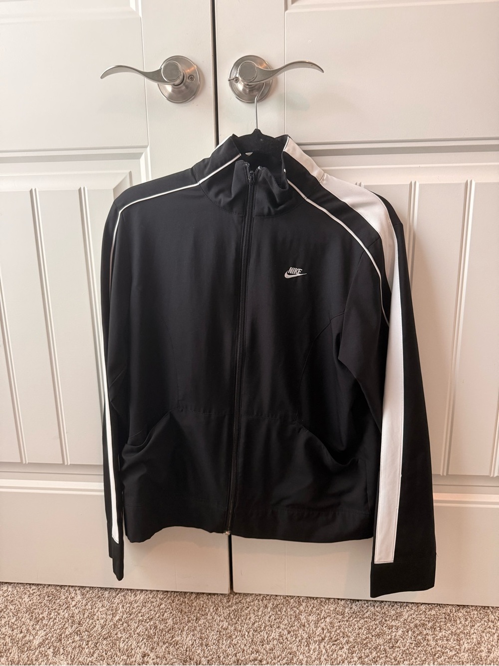 Nike Black Track Jacket with White Stripe Accents